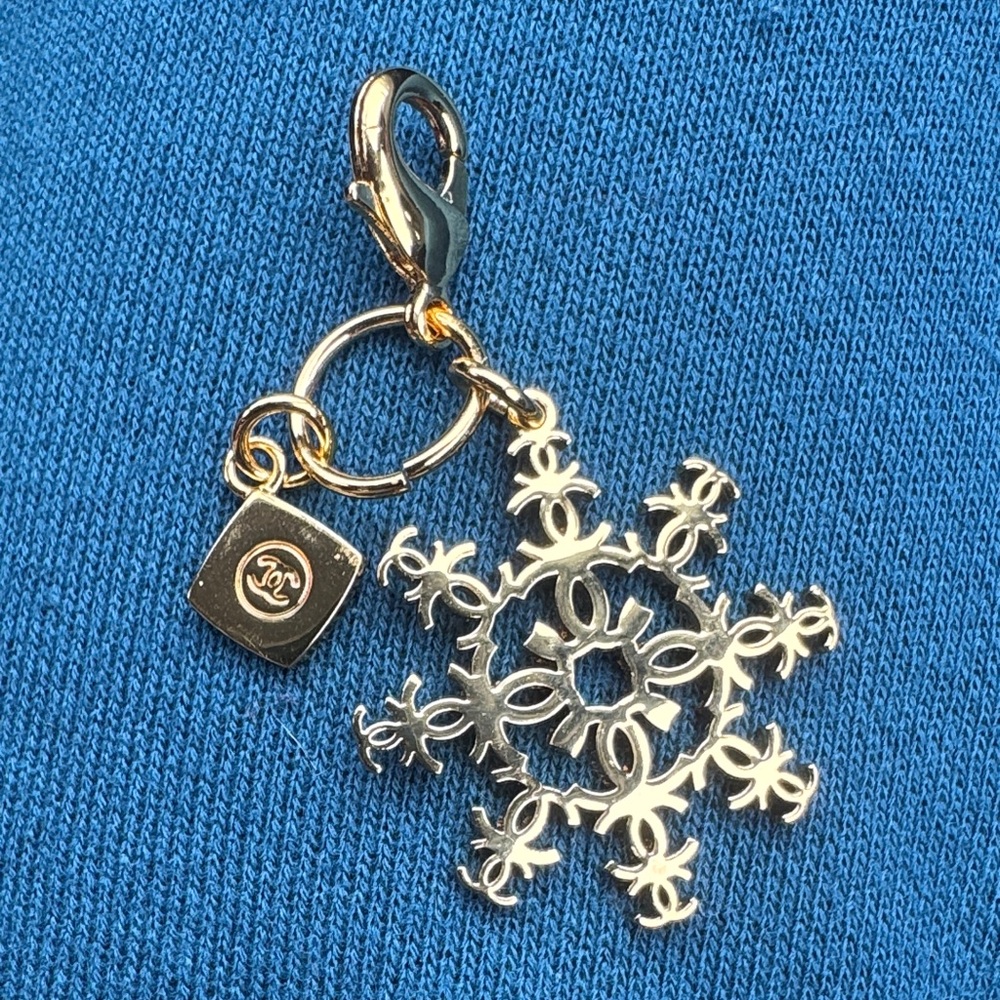 CHANEL Limited Edition Snowflake Charm - golden color